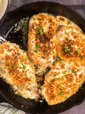 Longhorn steakhouse parmesan chicken in a skillet.