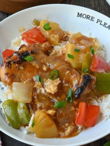 Hawaiian chicken on a plate with white rice.