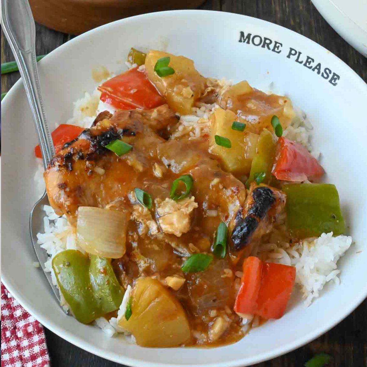 Hawaiian chicken on a plate with white rice.