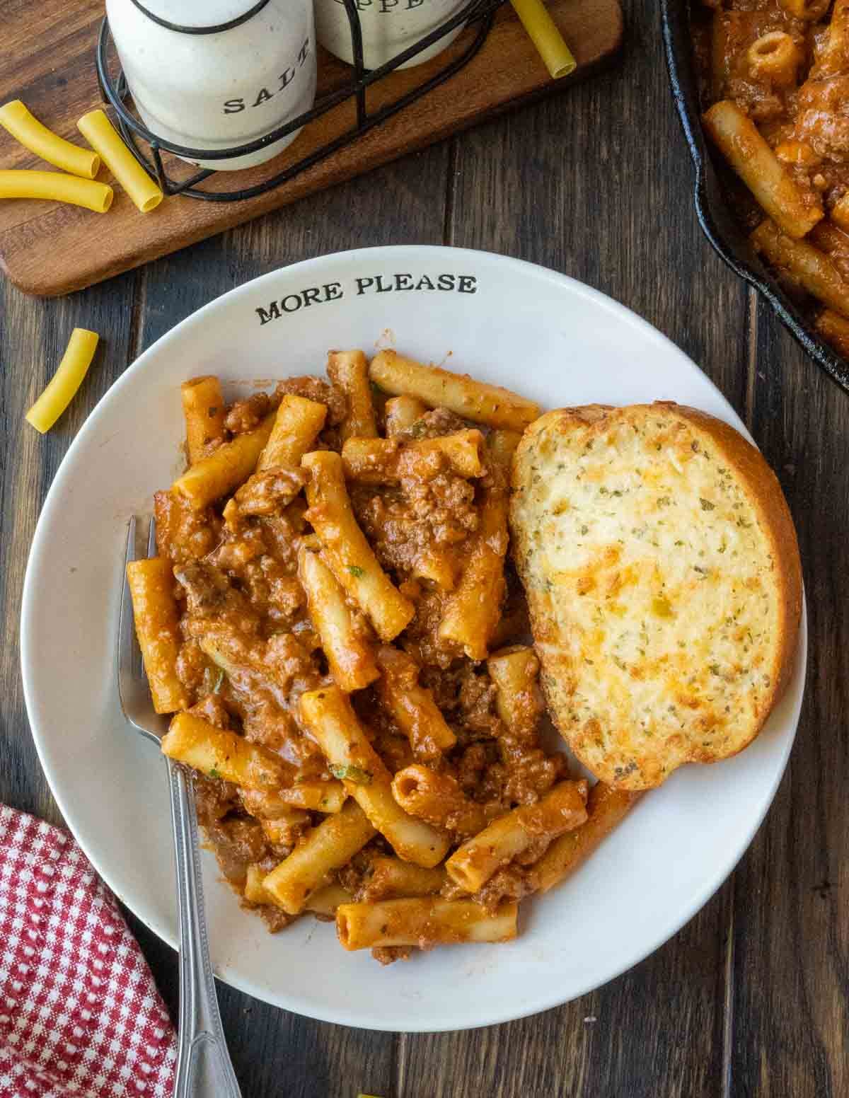 A plate of homemade beefaroni with texas toast.