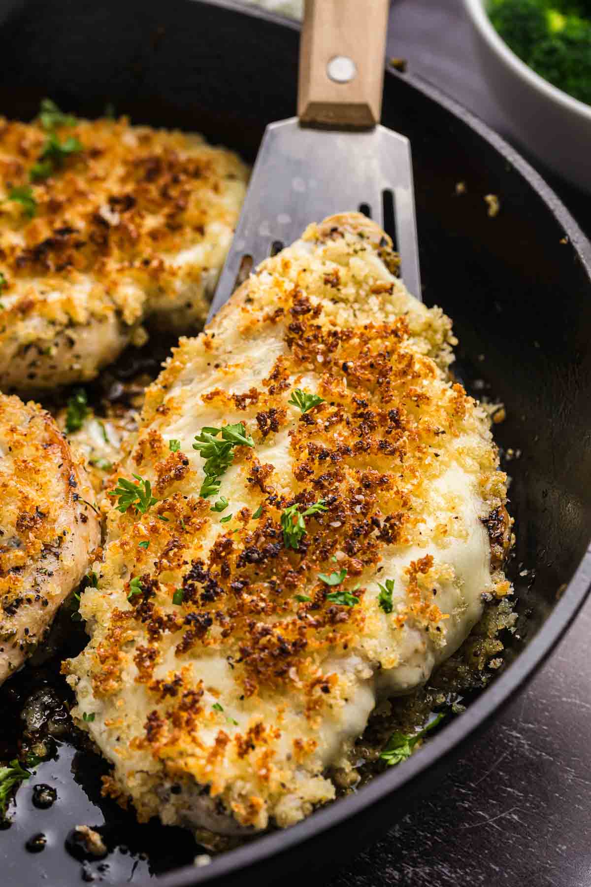 Longhorn steakhouse parmesan crusted chicken in a skillet.