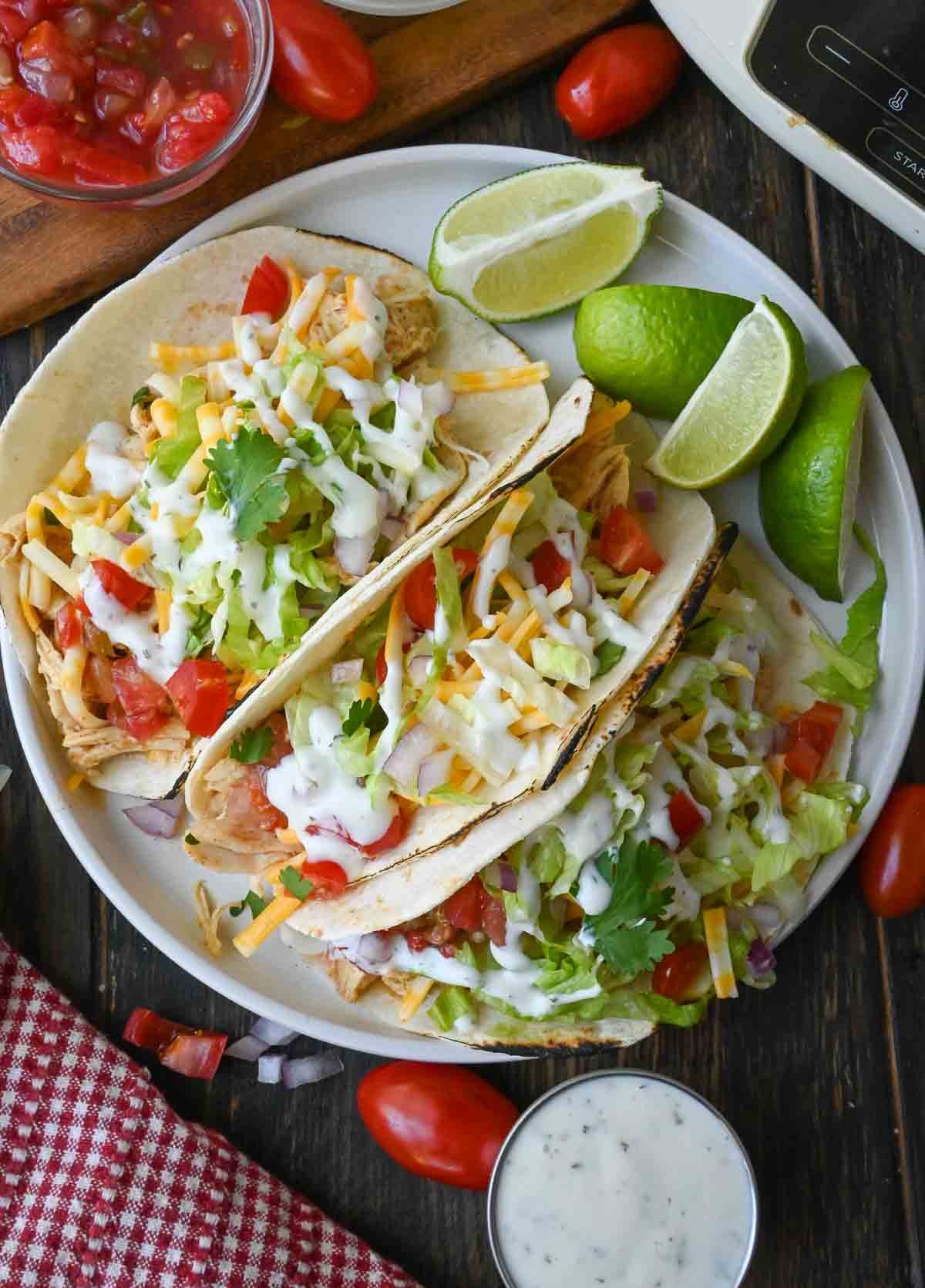 A plate of slow cooker ranch chicken tacos.