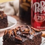 Pinterest graphic featuring a slice of dr pepper cake on a plate with a fork.