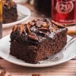 A slice of dr pepper cake on a plate.