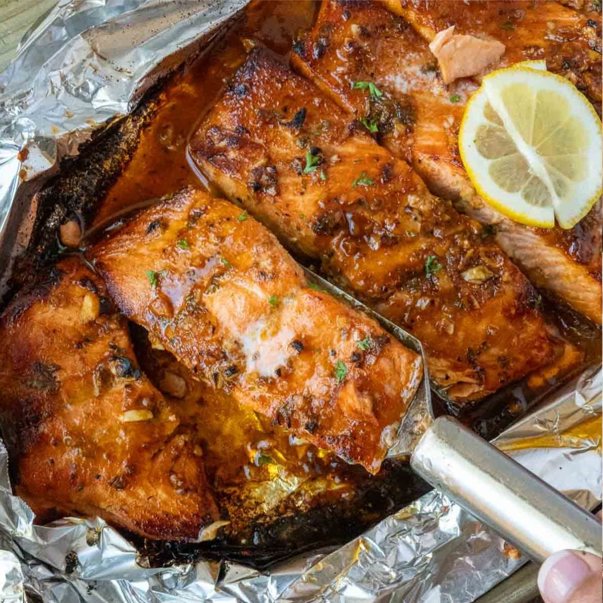 Honey baked steelhead trout in aluminum foil.