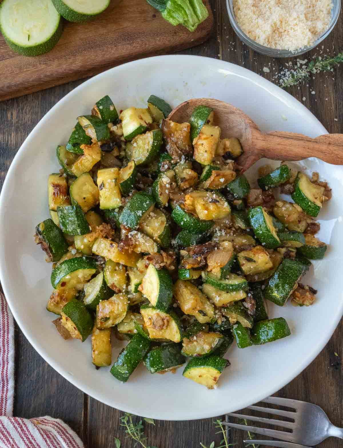 A plate of sauteed zucchini and onions.