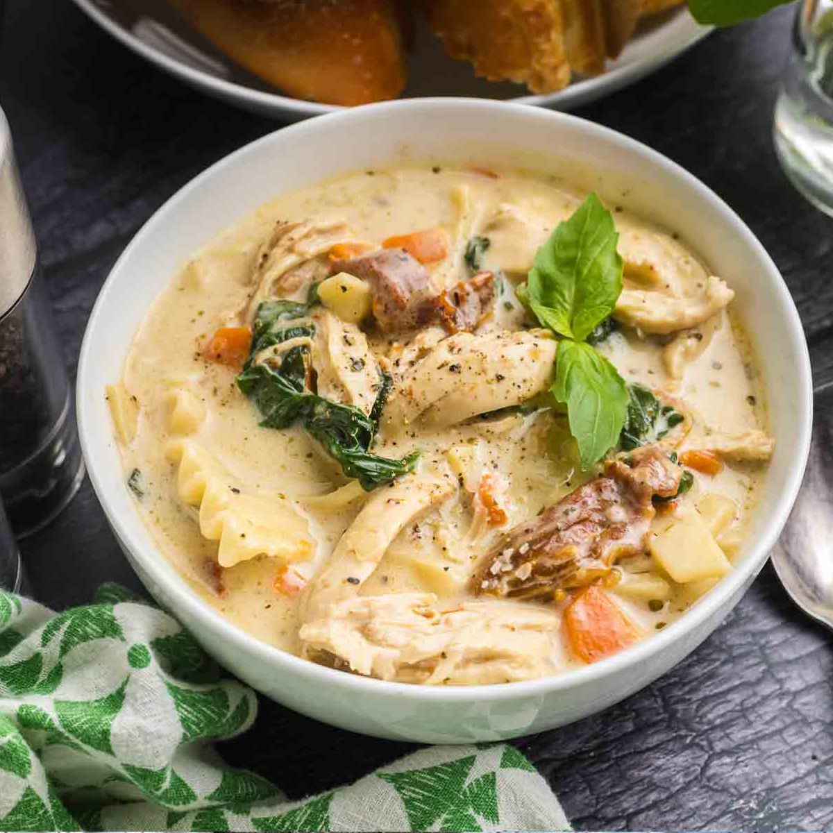 A bowl of white chicken lasagna soup.