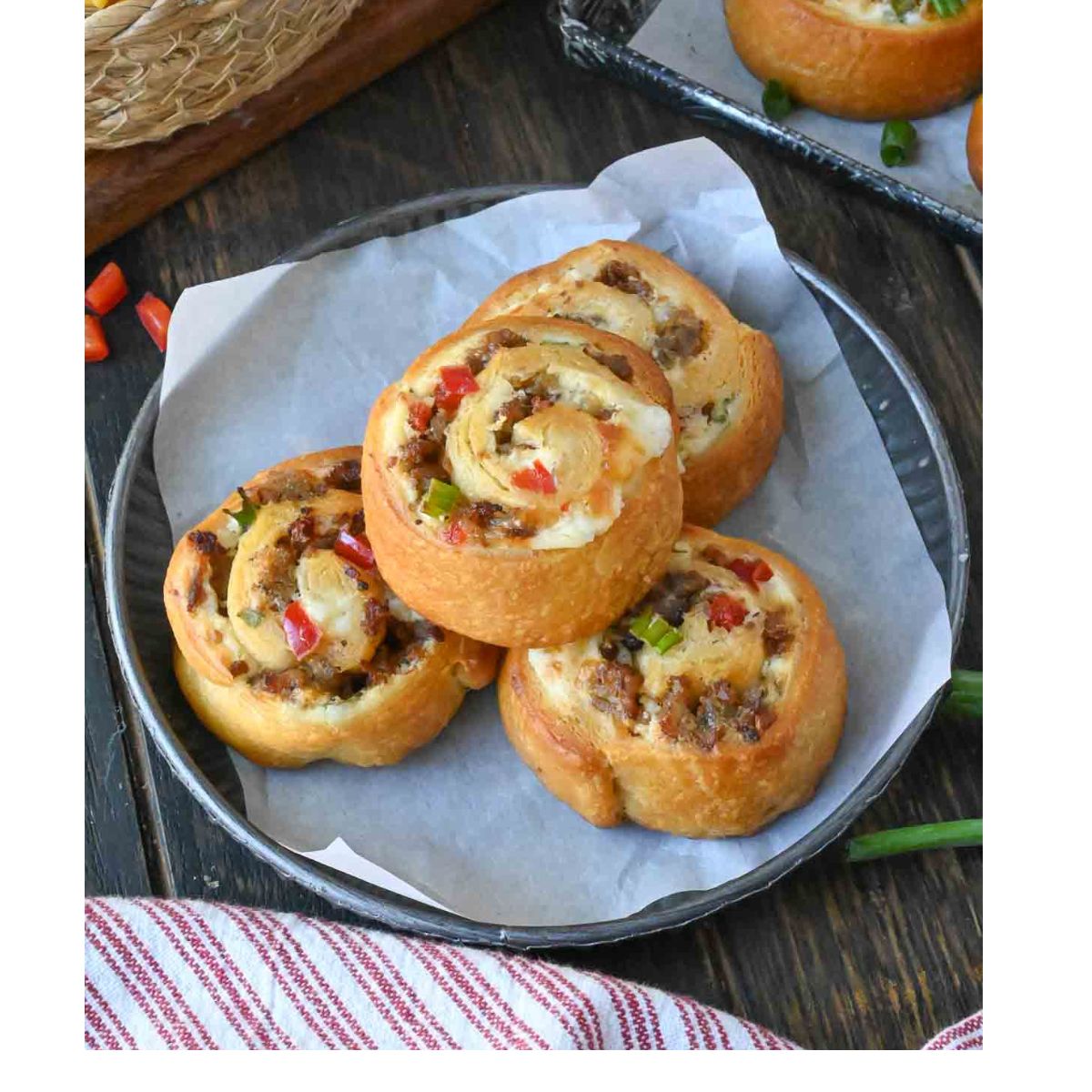 A plate of four sausage pinwheels.