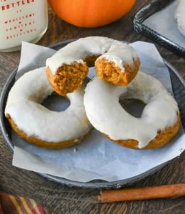Three donuts on a plate.