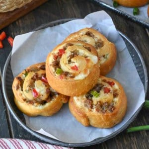 Three sausage pinwheels on a plate.