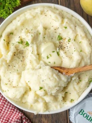 A bowl of mashed potatoes with boursin cheese.