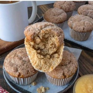 Apple cider muffins on a plate.