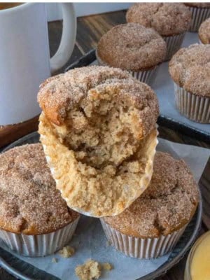 Apple cider muffins on a plate.