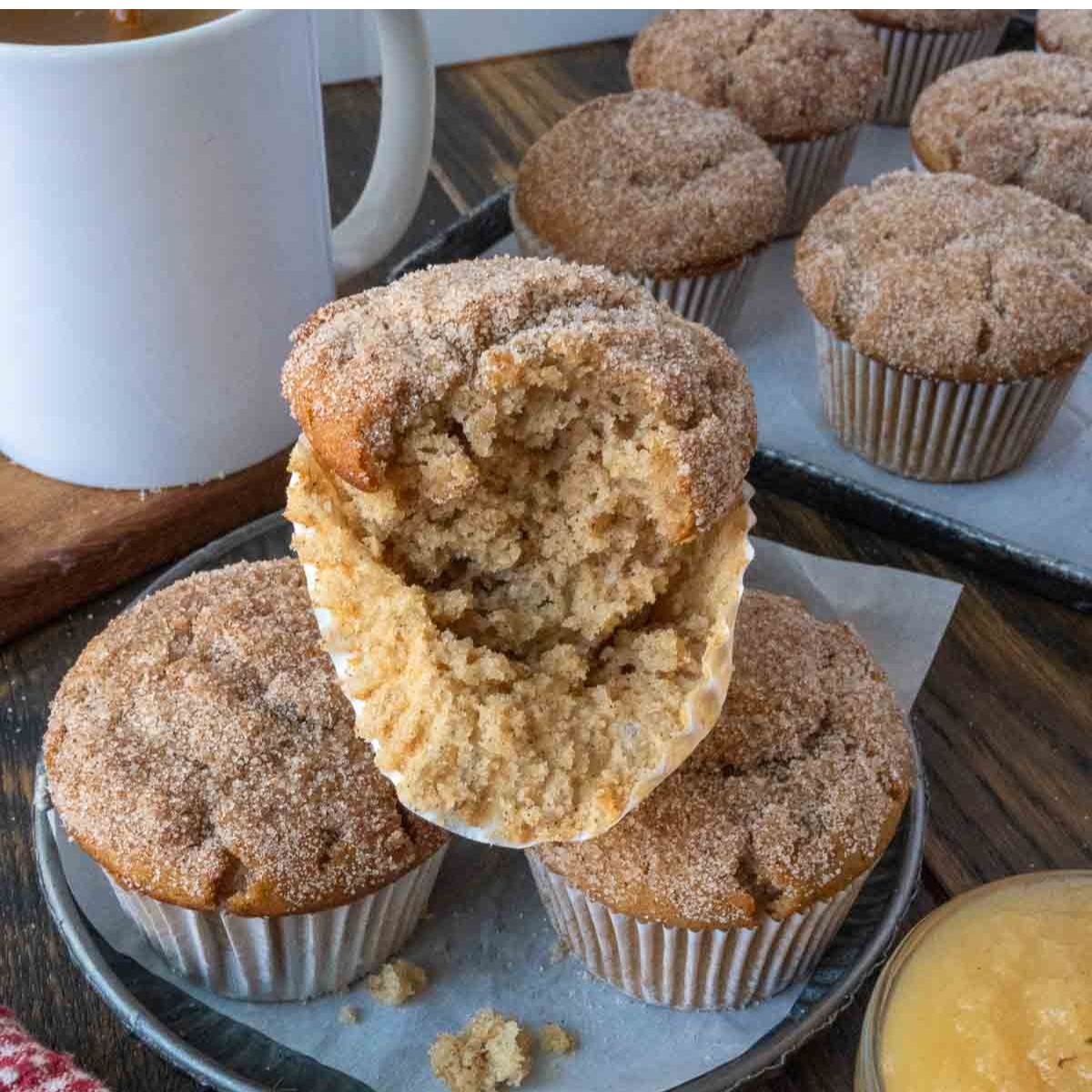 Apple cider muffins on a plate.