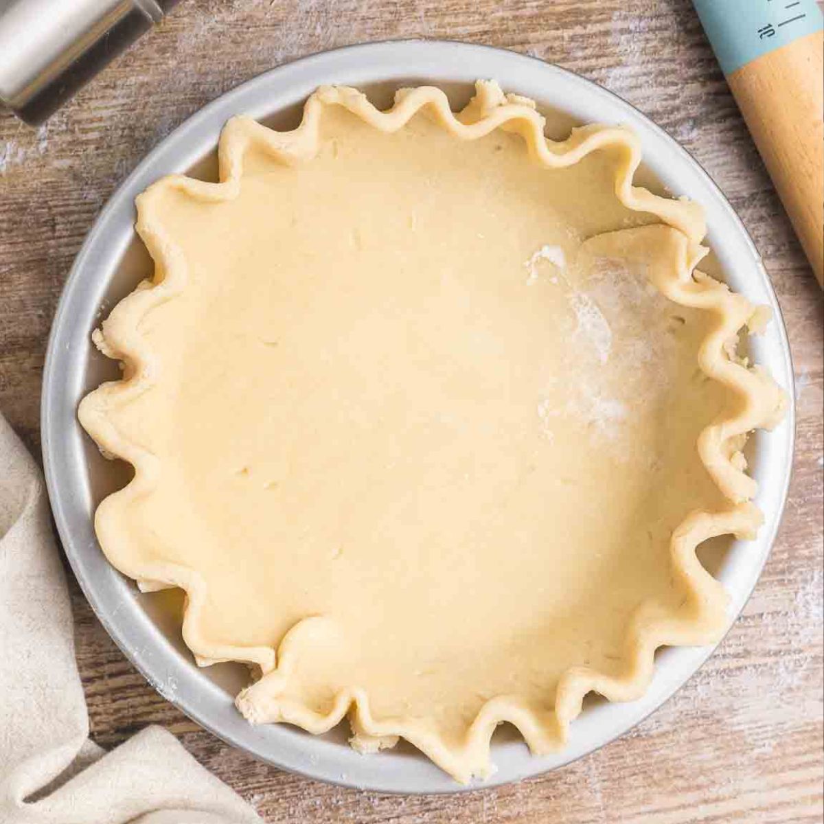 Homemade pie crust pressed into a pie tin.