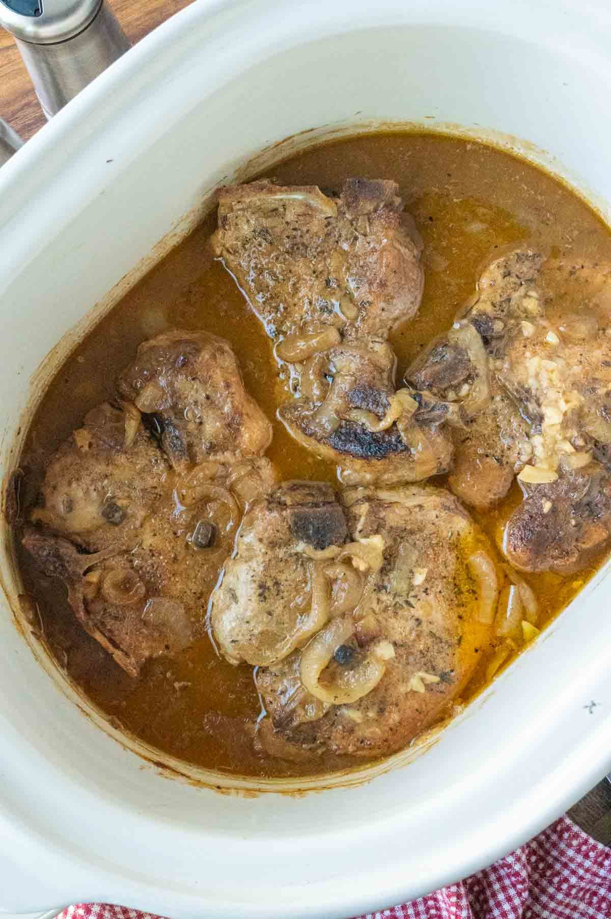 Smothered pork chops in a crock pot.
