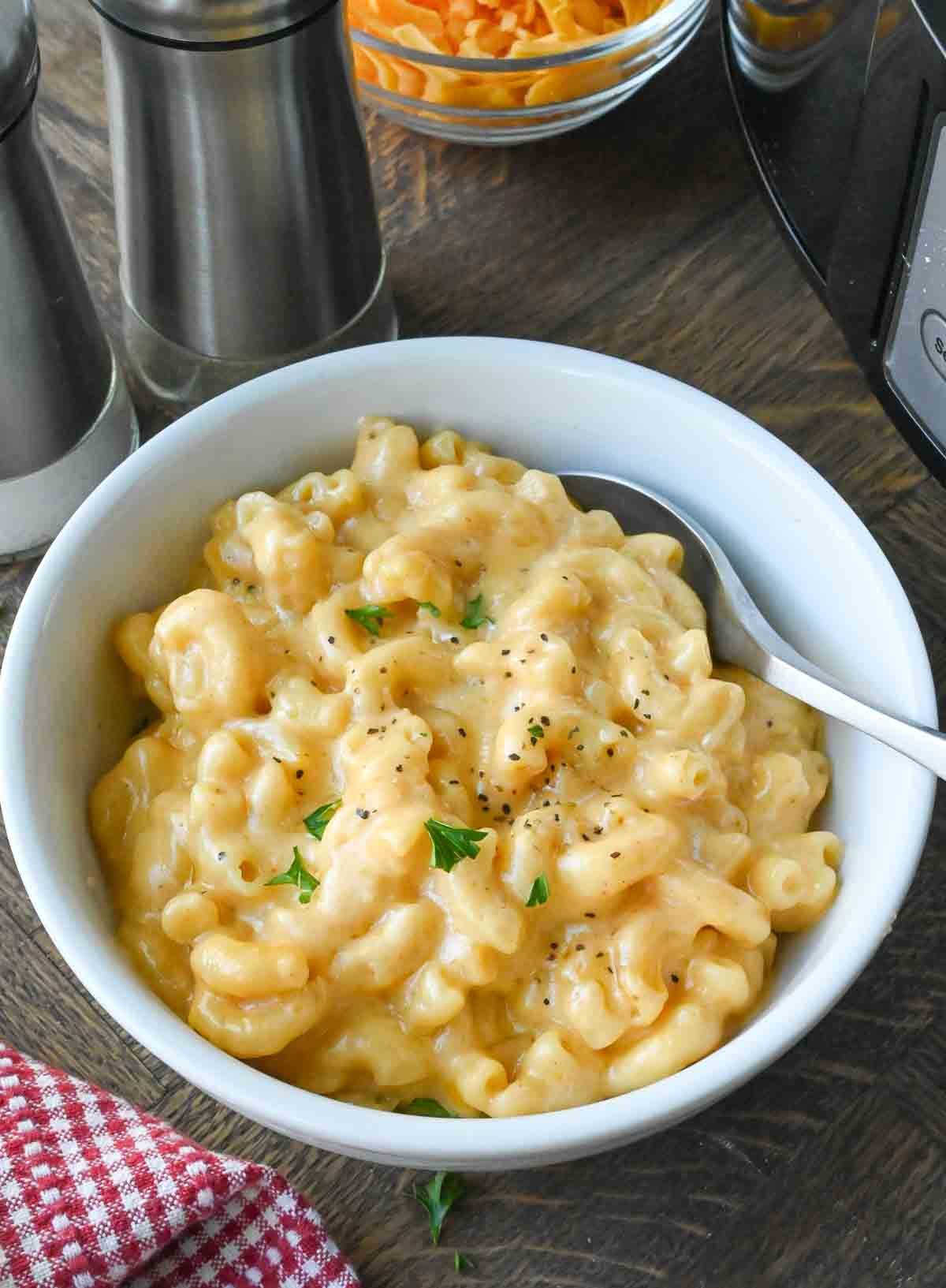 Mac and cheese in a white bowl.