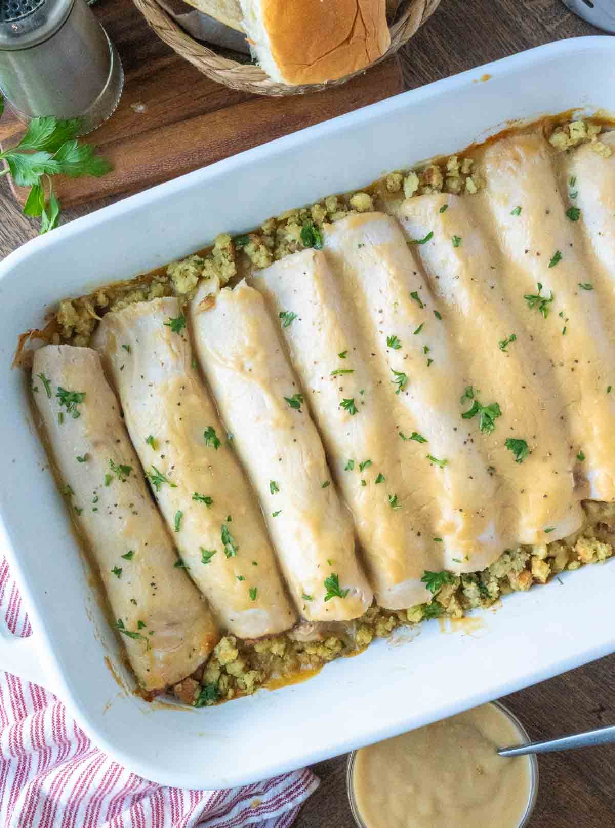 A baking dish full of turkey stuffing rollups.