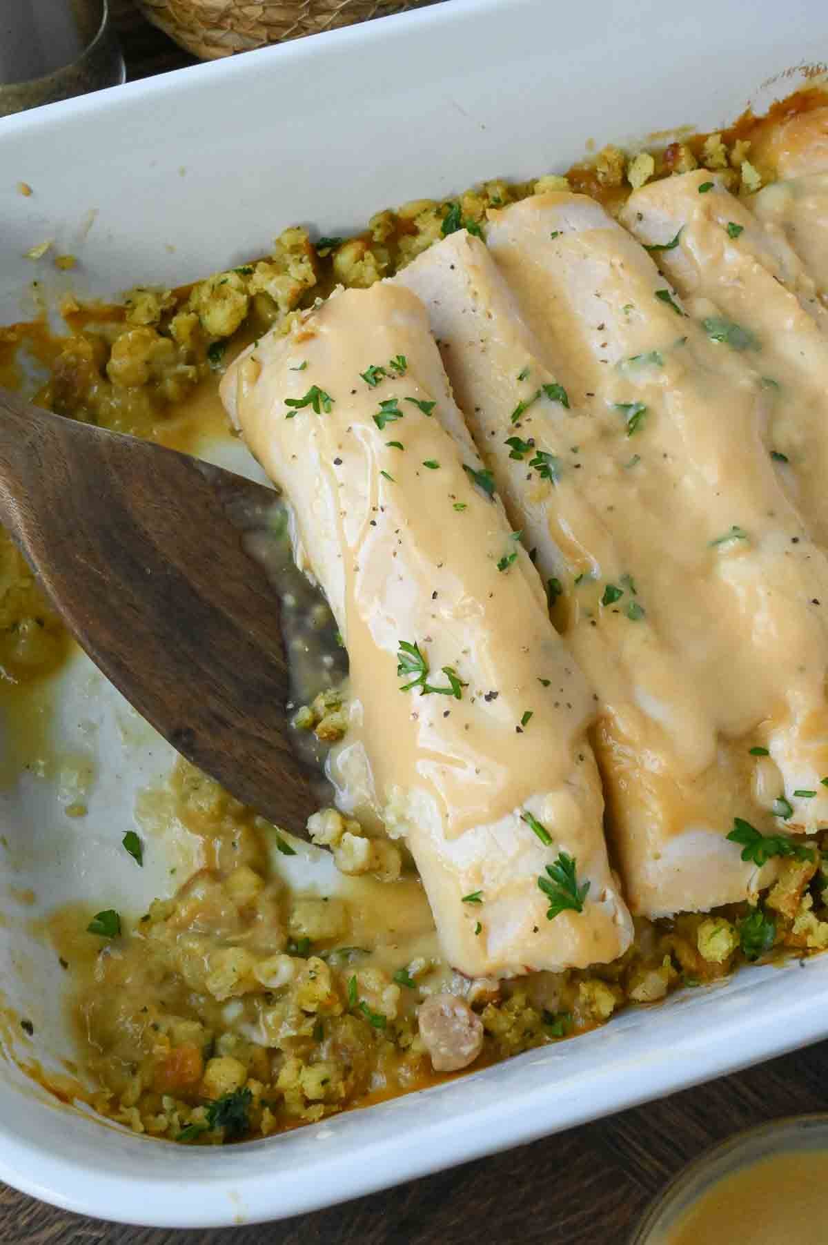A baking dish full of turkey stuffing roll ups.