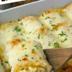 A spatula scooping up a lasagna roll up pinterest pin.