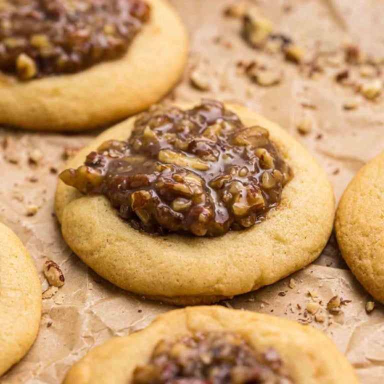 Pecan pie cookies on a piece pf parchment paper.
