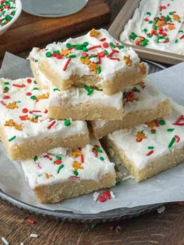 A stack of sugar cookie bars on a plate.