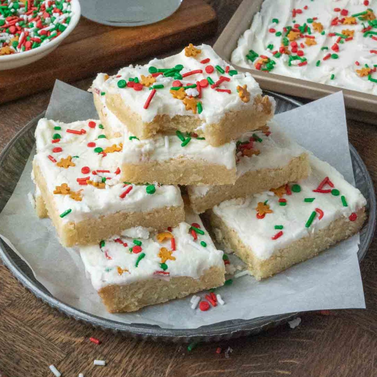 A stack of sugar cookie bars on a plate.