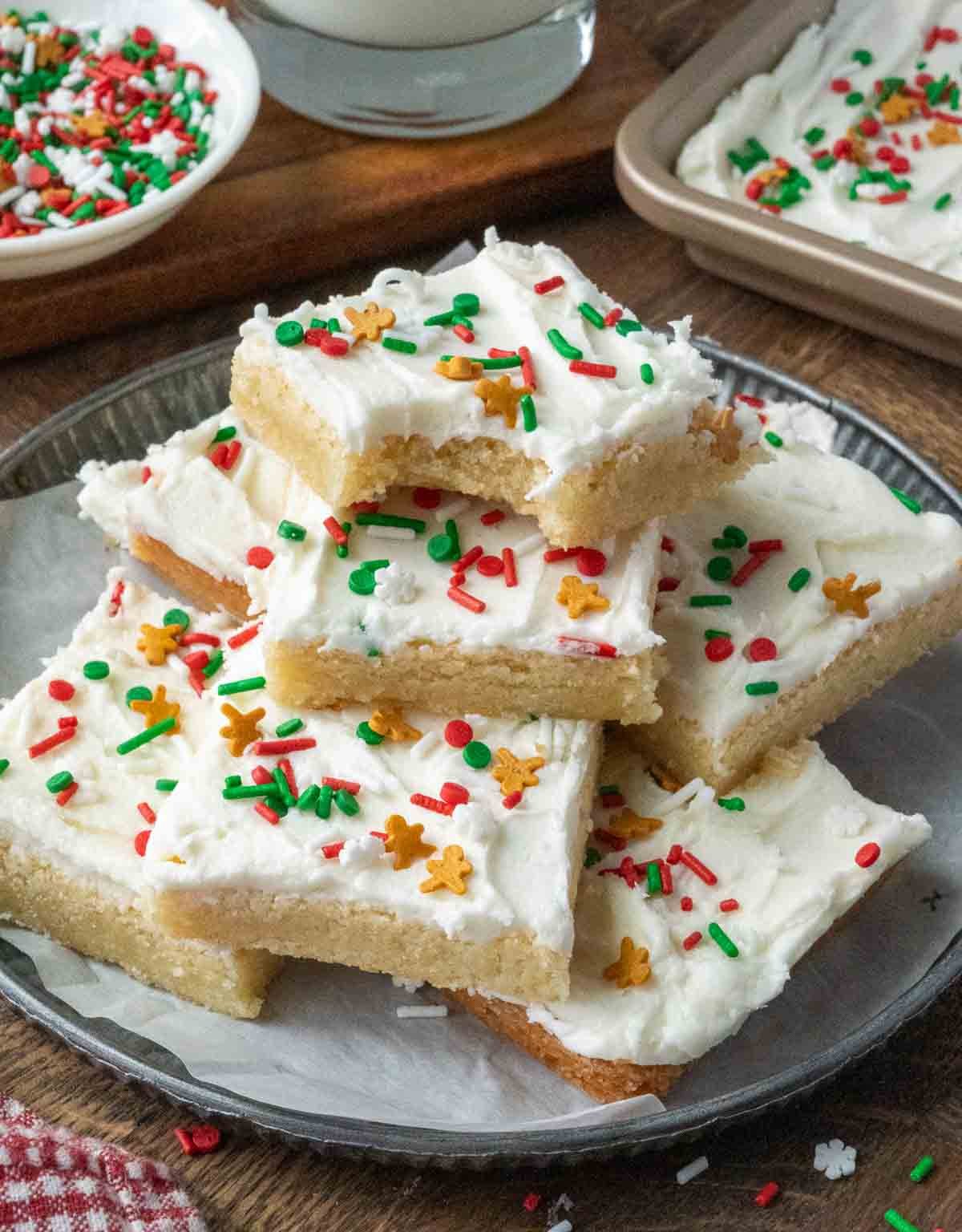 A stack of frosted sugar cookie bars.