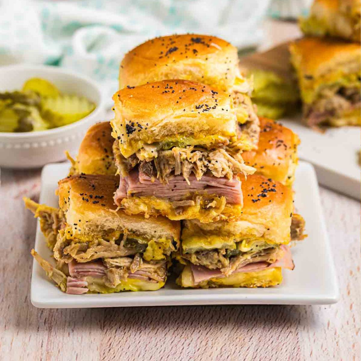 A plate of six cuban sliders.