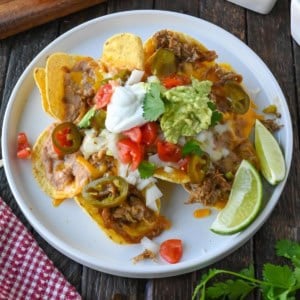 Carnita nachos on a plate.