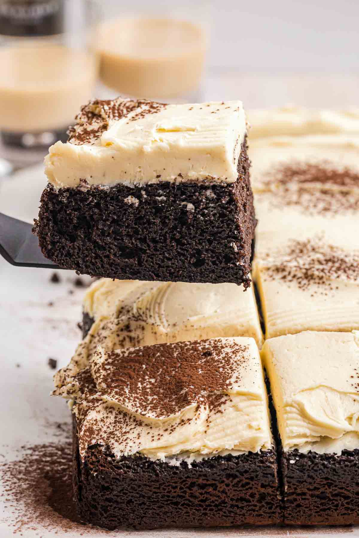 Lifting up a piece of Guinness chocolate cake with homemade frosting.