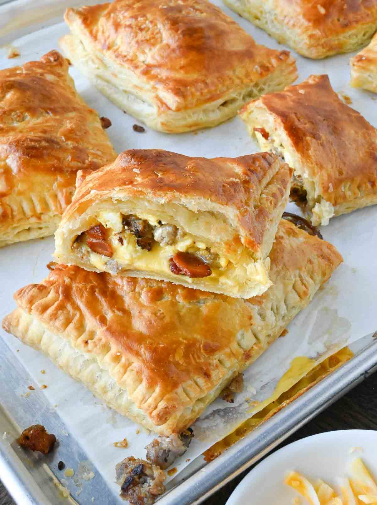 A baking sheet with breakfast hot pockets.