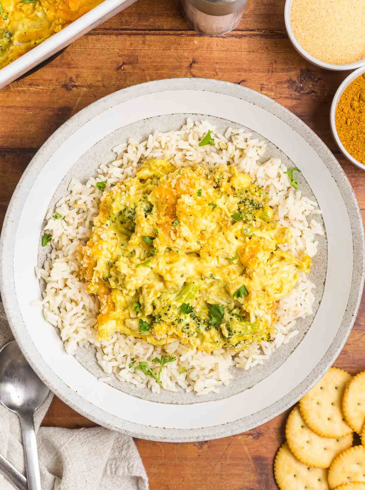 A plate of broccoli chicken divan casserole over rice.