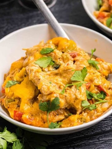 Close up view of a bowl of king ranch chicken casserole recipe.