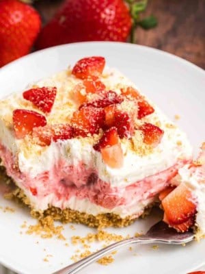 A plate with a slice of strawberry delight.