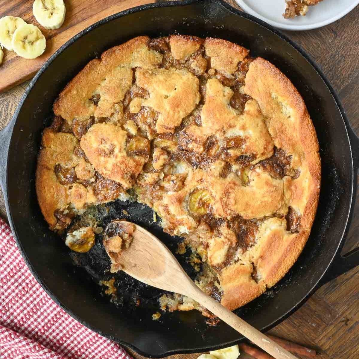 Old fashioned banana cobbler in a cast iron skillet.