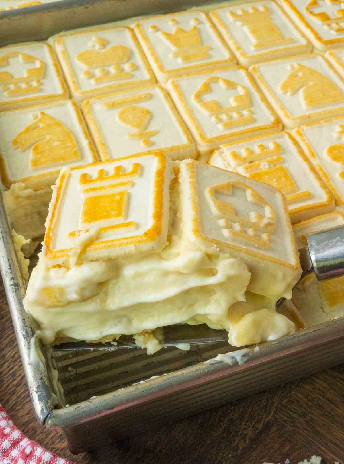 Taking a scoop of chessman cookie banana pudding.