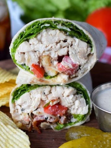 Chicken caesar salad wrap cut in half.
