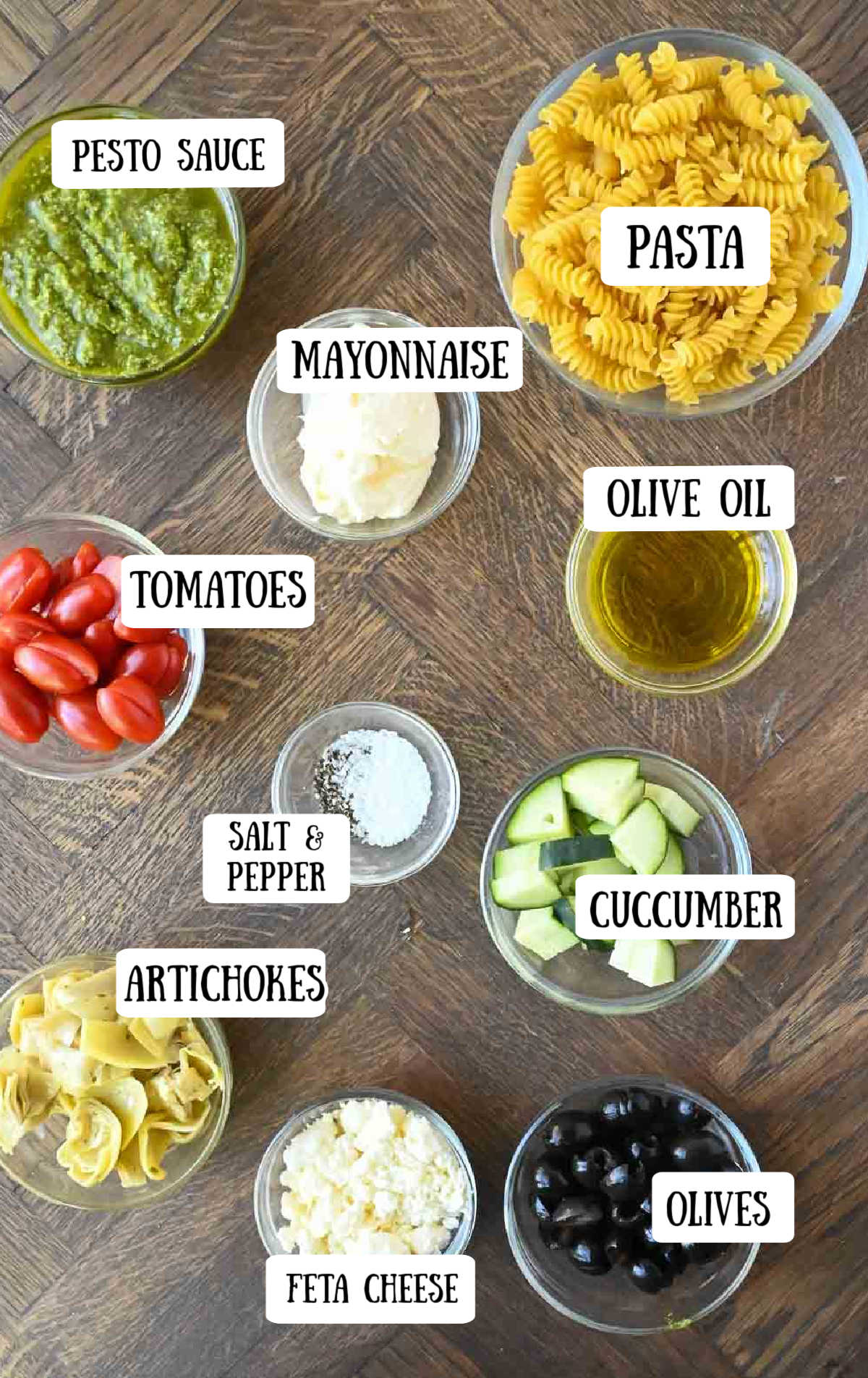 Labeled ingredients for creamy pesto pasta salad.