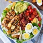 Close up of a plate of grilled chicken caesar salad.