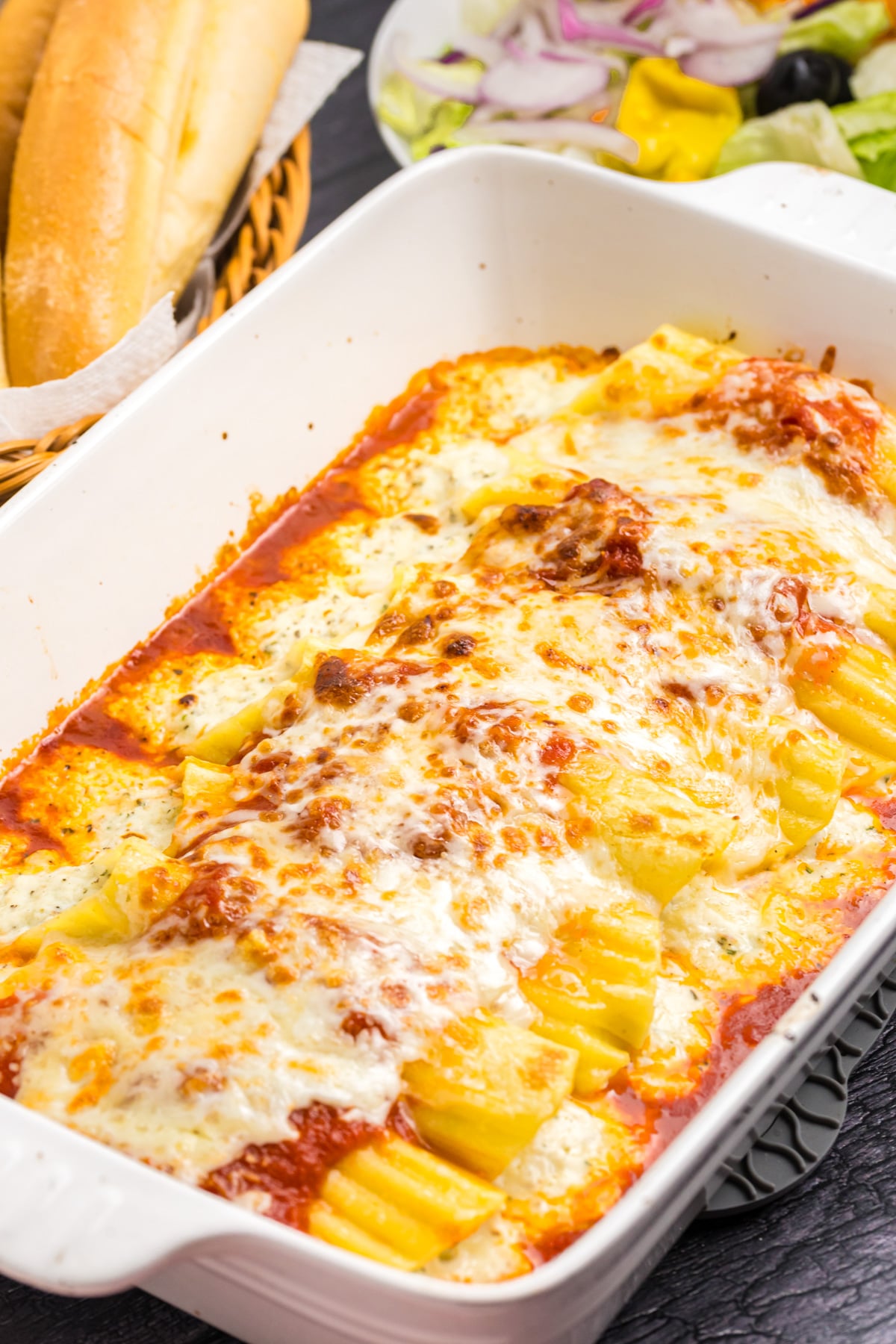 Olive garden manicotti in a baking dish.