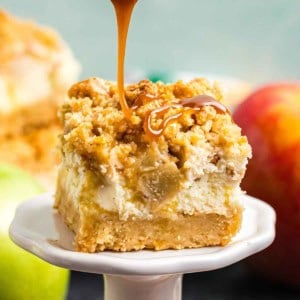 Caramel drizzled over the top of a cheesecake bar.