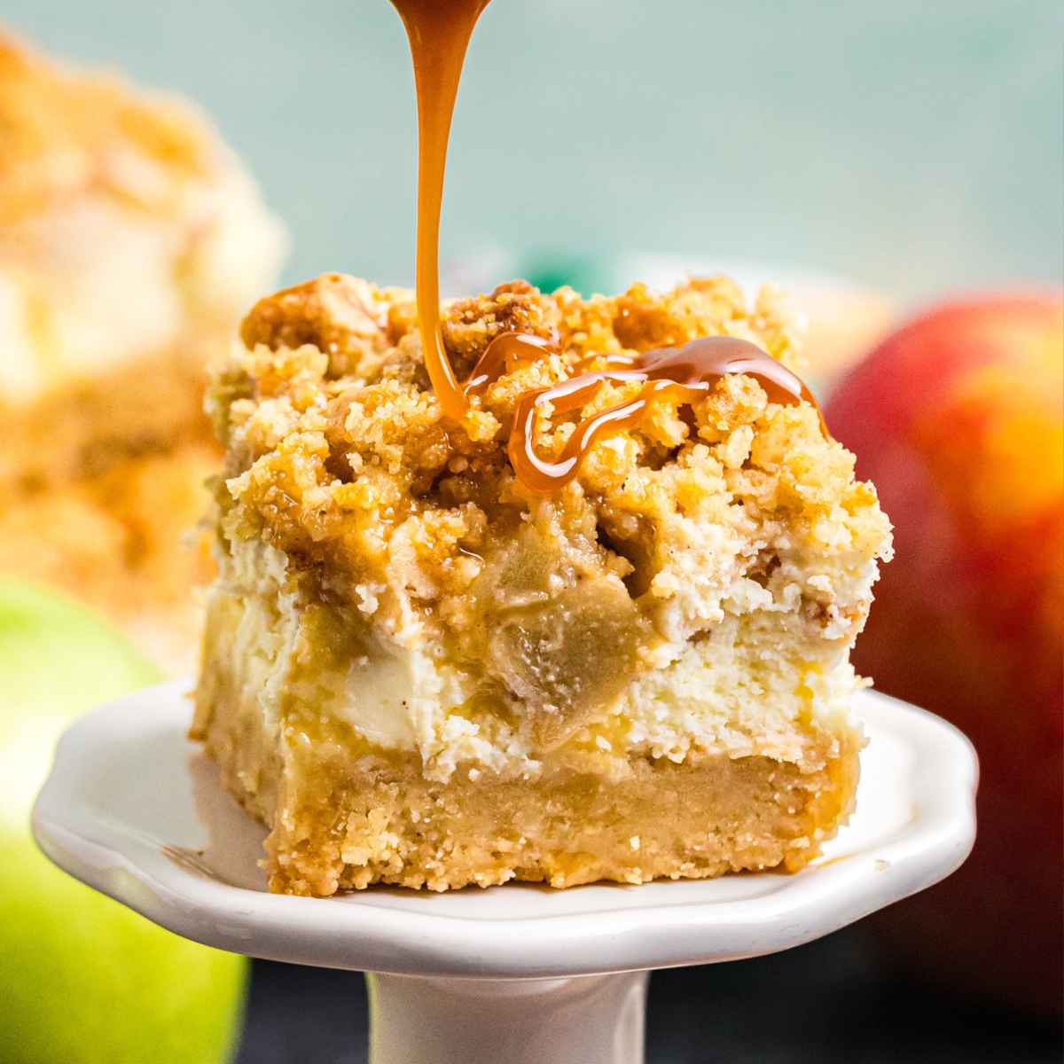 Caramel drizzled over the top of a cheesecake bar.