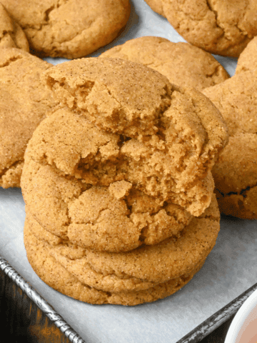 Pumpkin snickerdoodles cookies on a baking sheet.